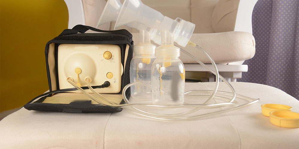 breast pumps sitting on bed
